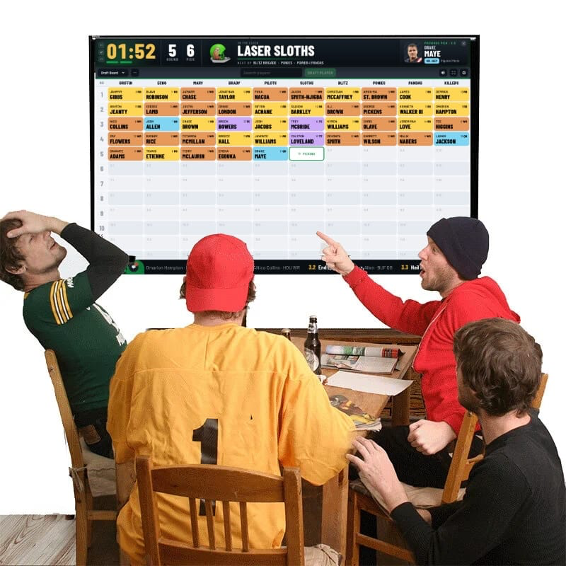 Friends celebrating around the TV at their FanDraft fantasy football draft party